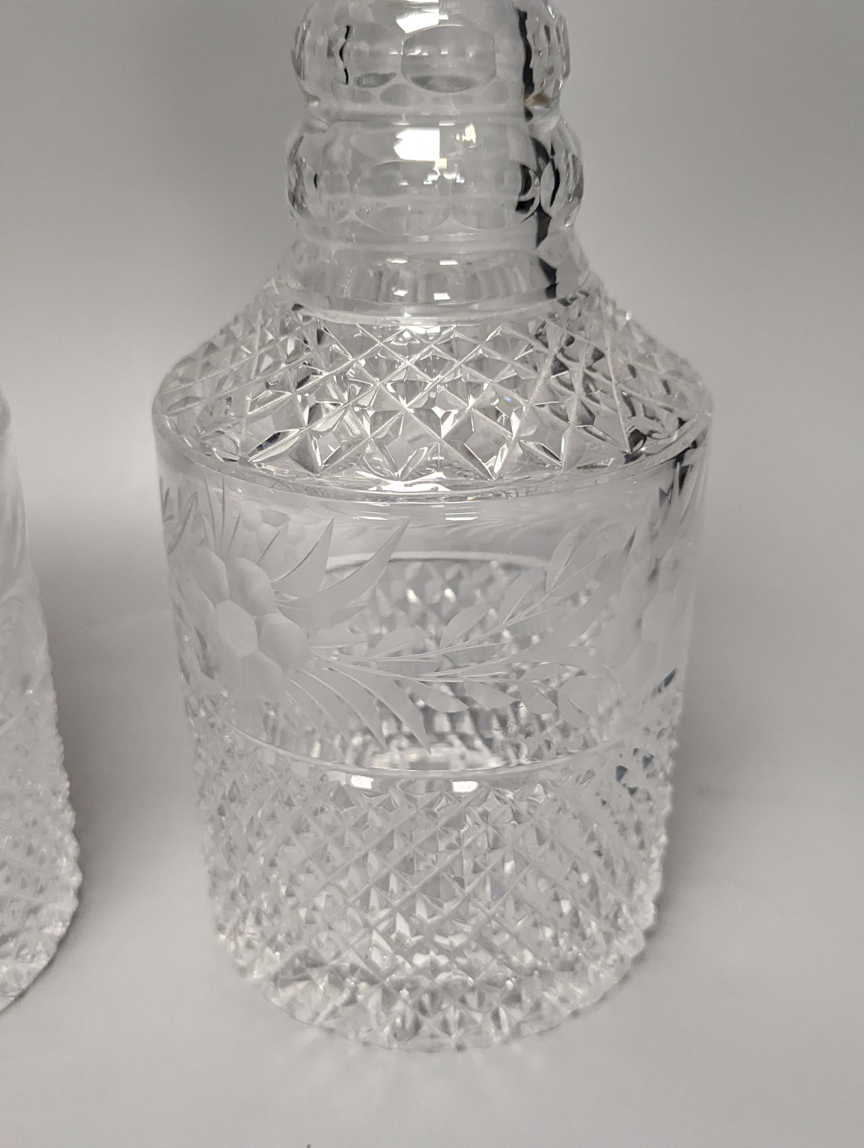 A pair of silver mounted glass decanters, with stoppers, height 28cm